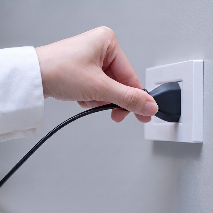 Plugging in BlizzAir portable cooling device